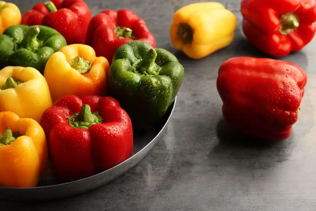 Variety of fresh, colorful bell peppers.  If you don't want the heat, bell peppers make a great substitute for jalapeño peppers due to their similar taste and texture.