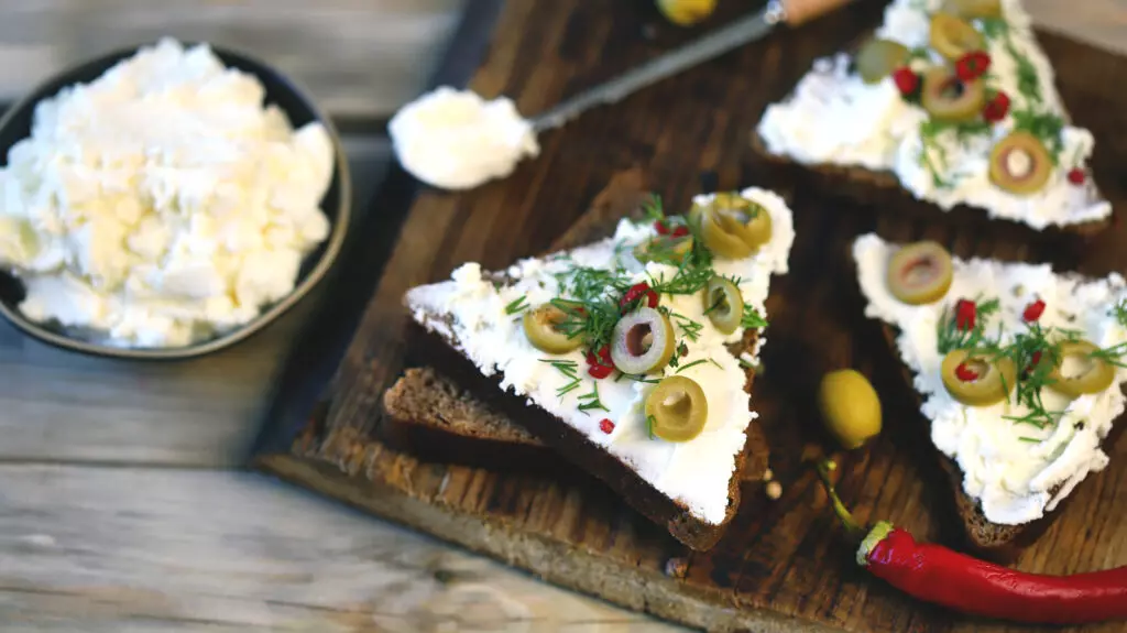 Mascarpone on sliced bread with olives.  This is a great replacement for cream cheese in baking and sweeter dishes
