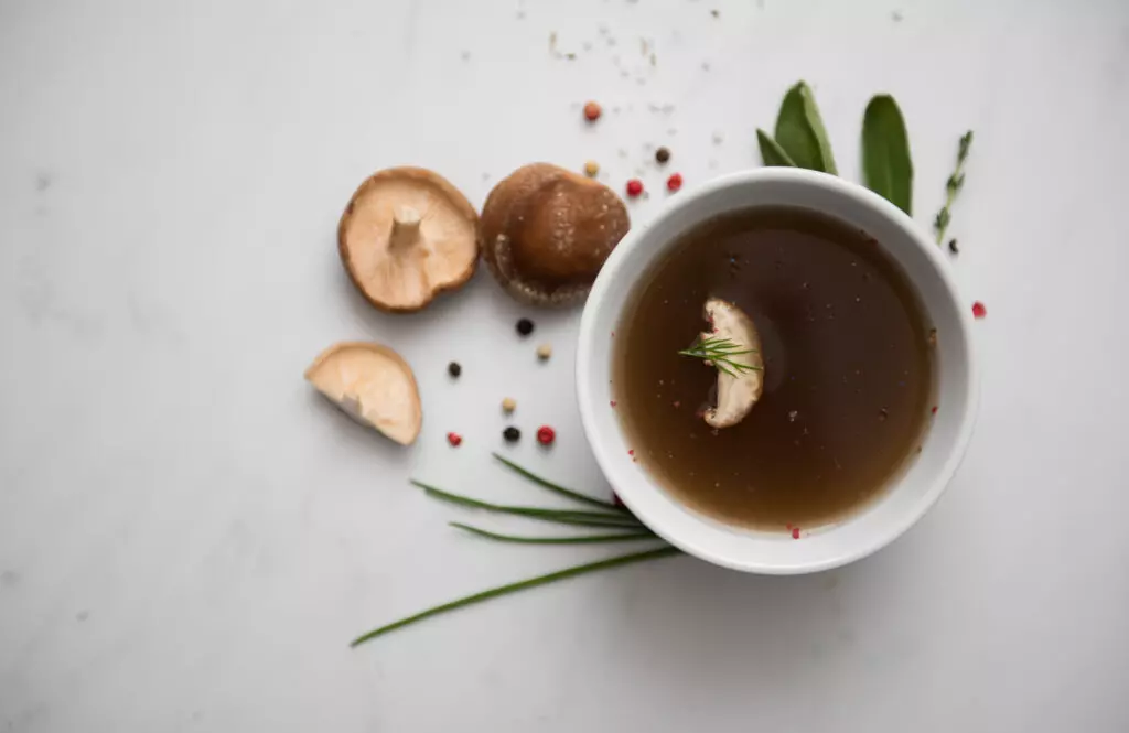 Mushroom broth with mushrooms and herbs.  Common ingredients and an earthy flavor make this a great beef broth substitute.