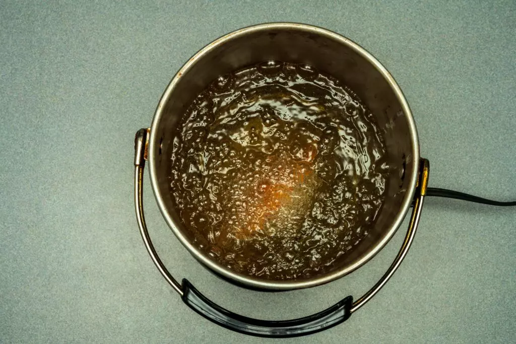 Peanut oil boiling in a pot.  It's high smoke point make it a great bacon grease substitute for frying.