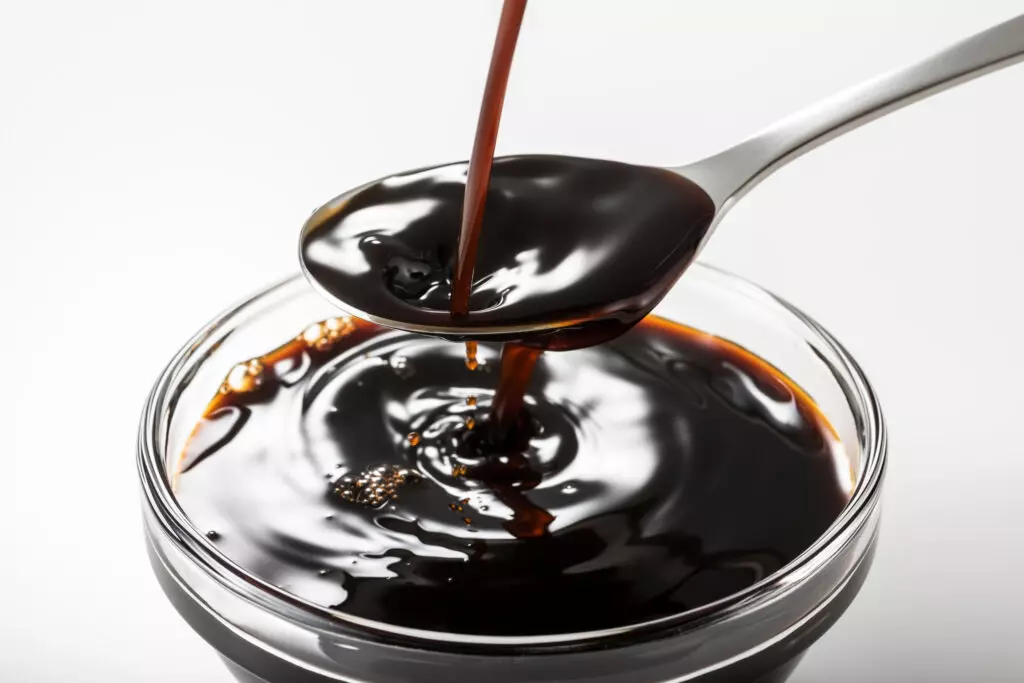 Close up of Worcestershire sauce in a bowl.  Deep, rich and unique flavors make this a great beef broth substitute.