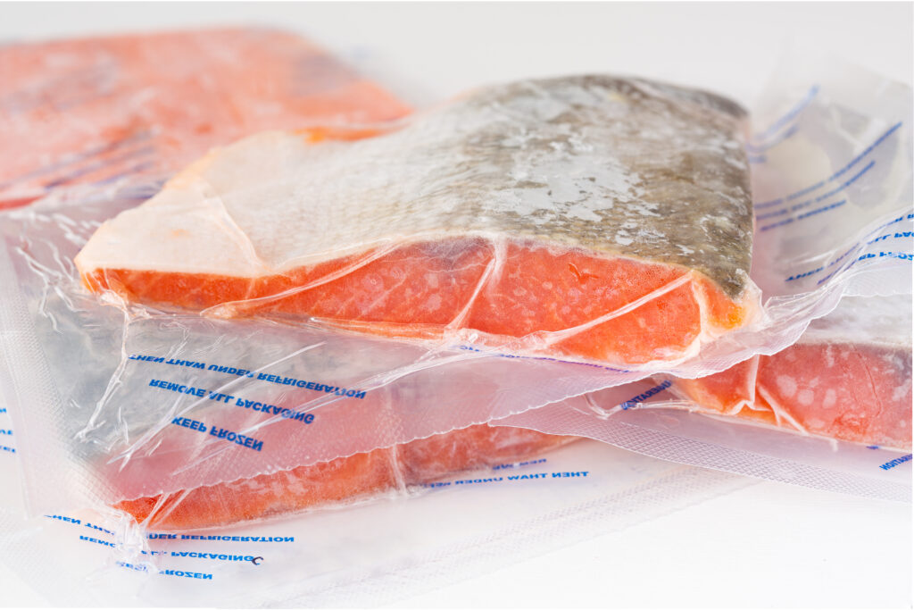Raw salmon frozen in vacuum sealed bags.  Salmon is good in the freezer for up to 3 months without any degradation of quality.