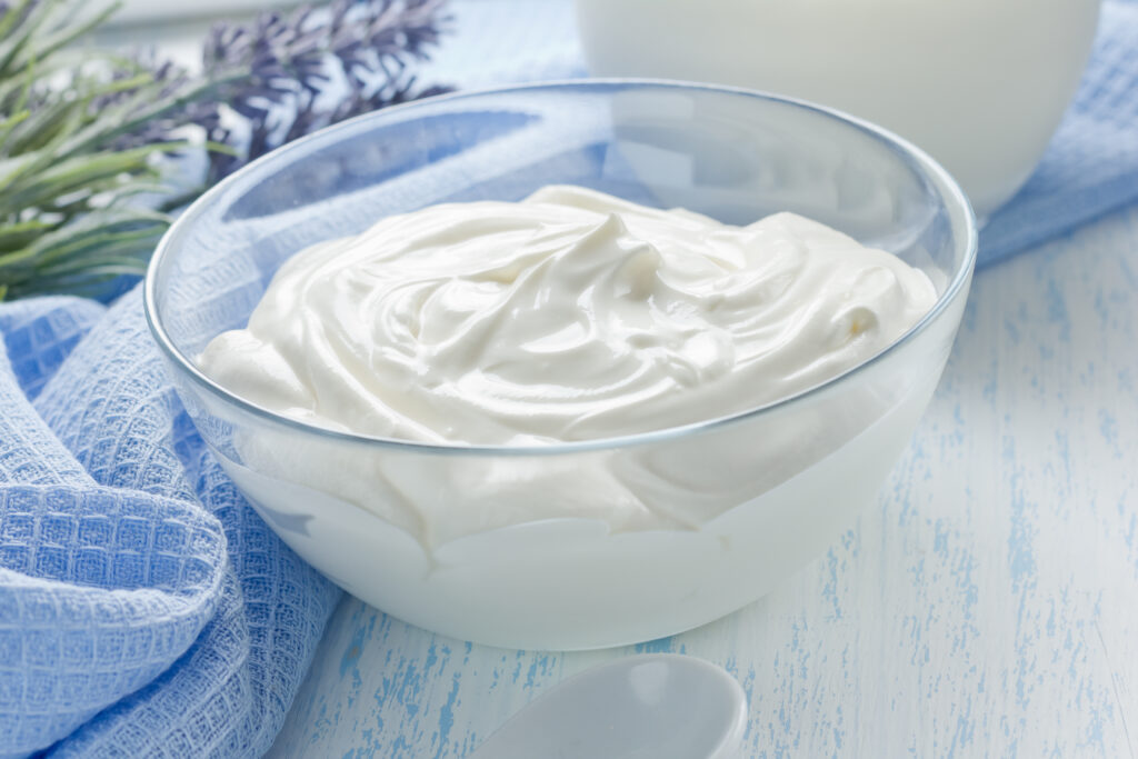 Creamy Greek yogurt in a glass bowl.  