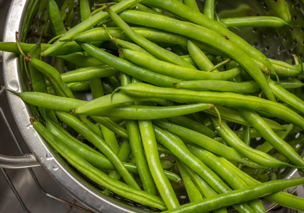 Green beans in a strainer
