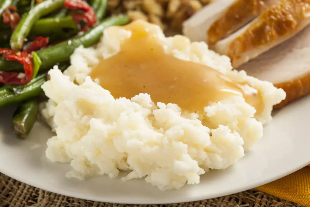 Close up of mashed potatoes and gravy.  Mashed potatoes are good in the fridge for 3-4 days. 
