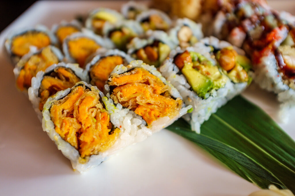 Close up of sweet potato rolls.  This crunchy dish is a great vegetarian sushi roll option.