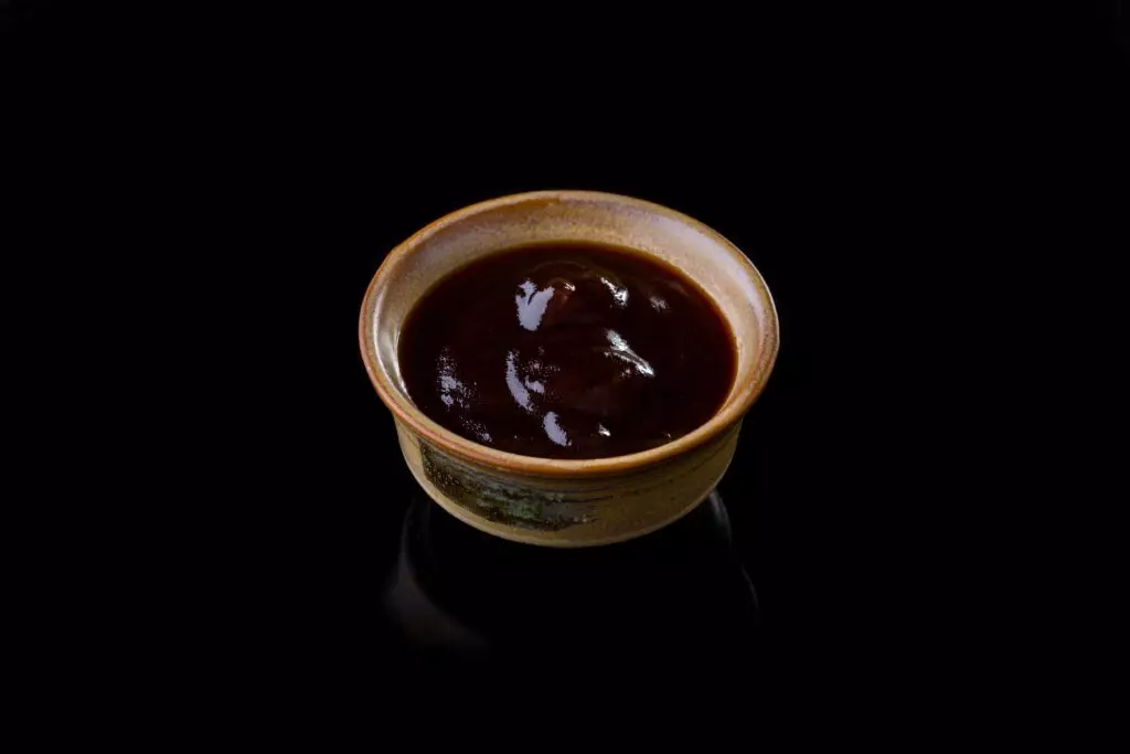 Eel sauce (unagi sauce) in a clay pot.  The thick texture is a defining characteristics of this flavorful sauce. 