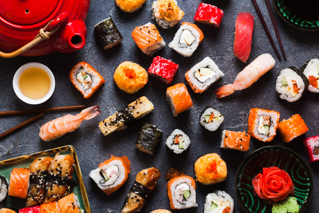 Various types of sushi including maki rolls and nigiri rolls