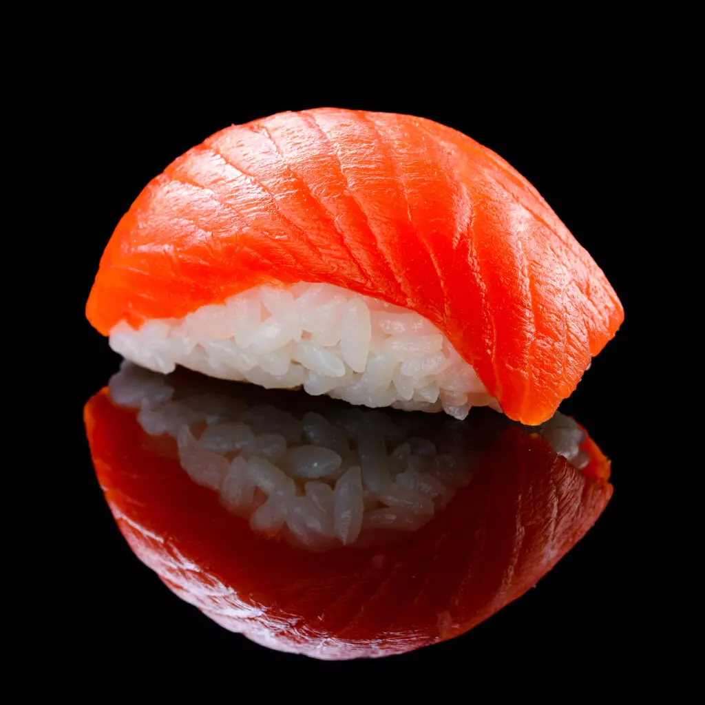 Close up of smoked salmon nigiri.  If you love salmon but prefer it cooked, this is a great cooked sushi option for you. 
