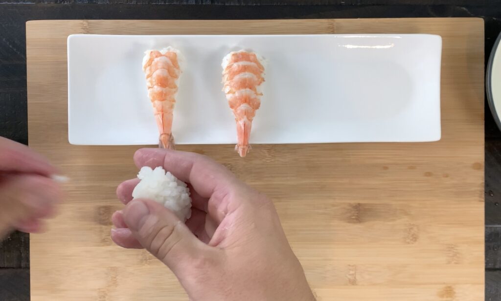 Form ball of sushi rice