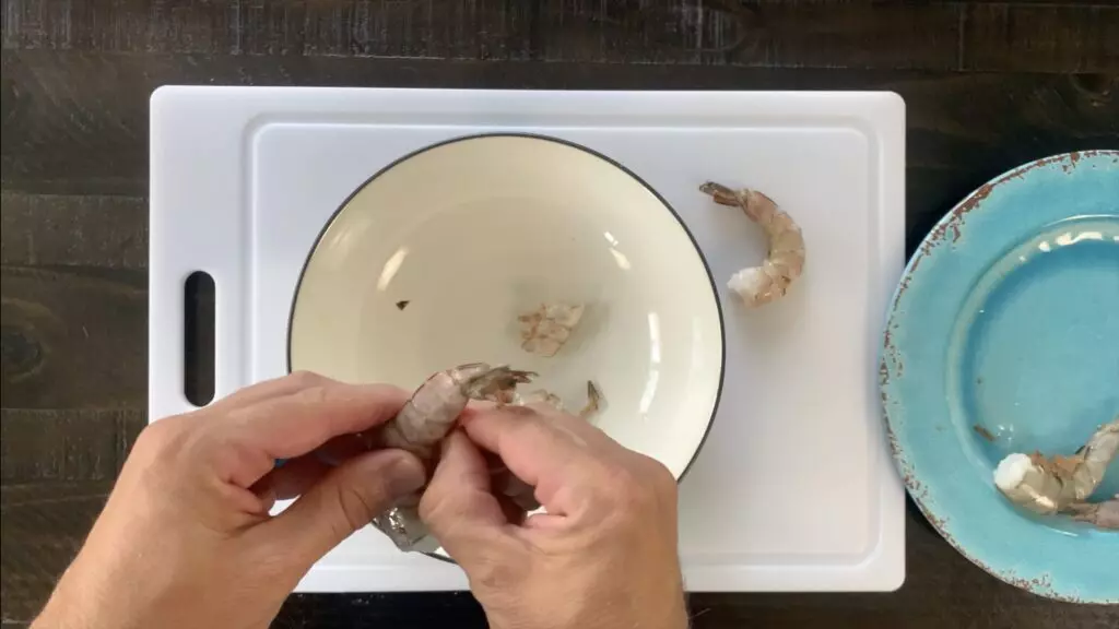Removing shells from shrimp