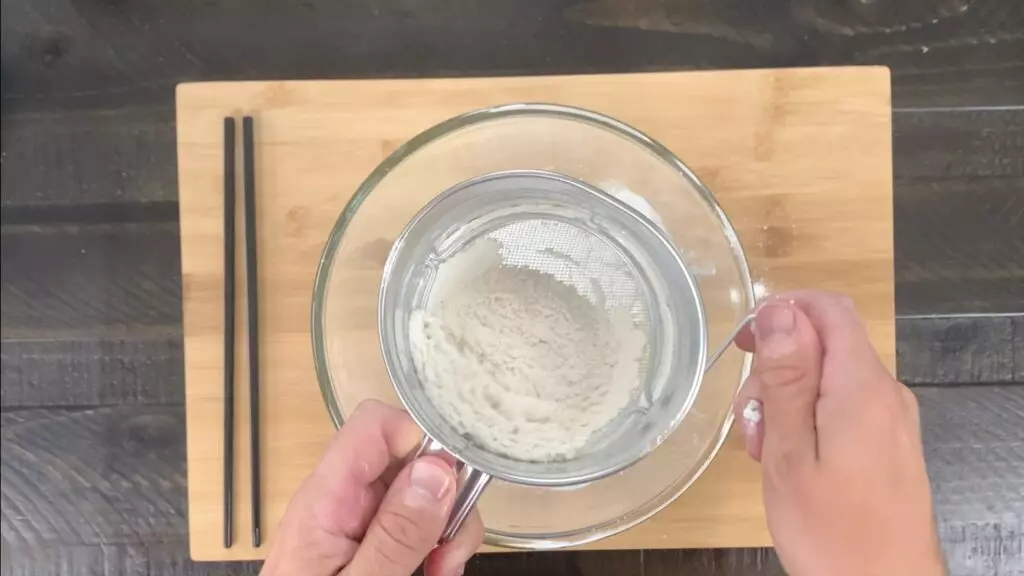 Sift flour into egg/water mixture for tempura batter