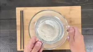 Sift flour into egg/water mixture for tempura batter