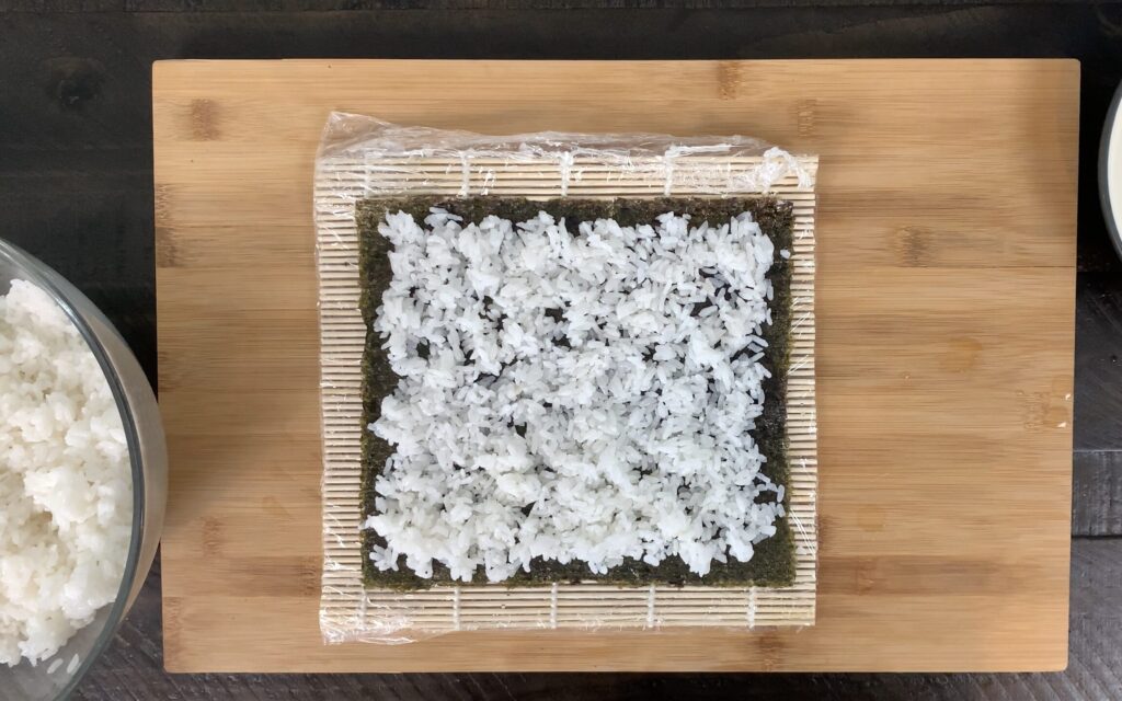 Spread rice on nori sheet