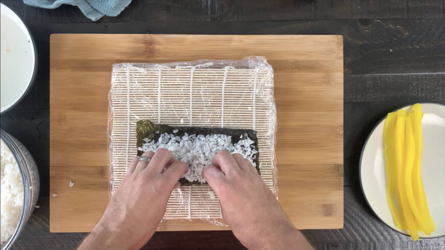 Press sushi rice onto the nori sheet
