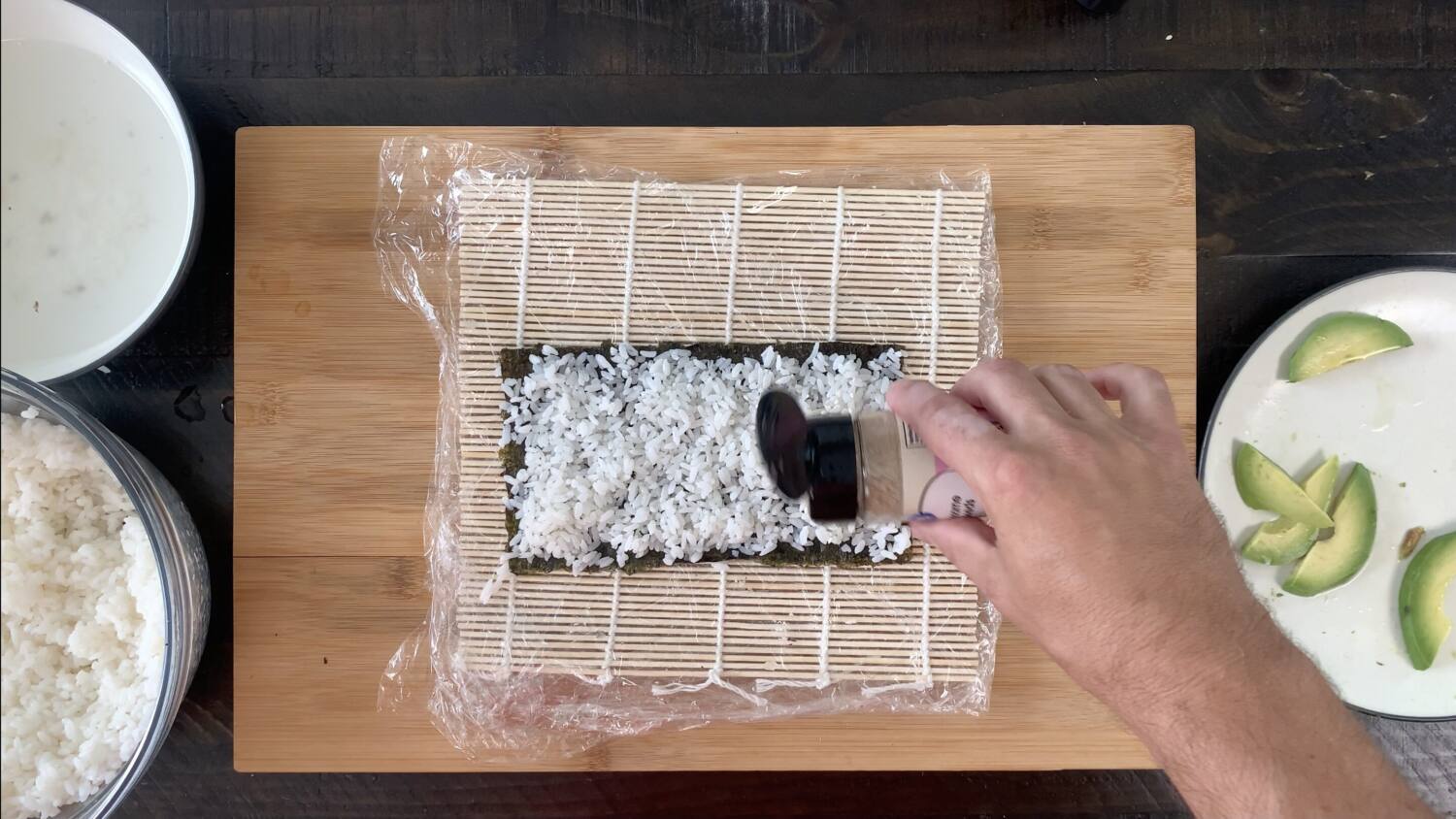 Spread the sesame seeds over the rice for the California roll
