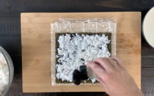 Sprinkle sesame seeds over rice