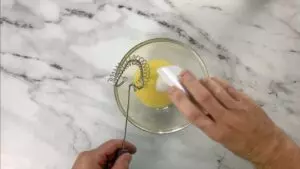 Mix sugar and salt into egg