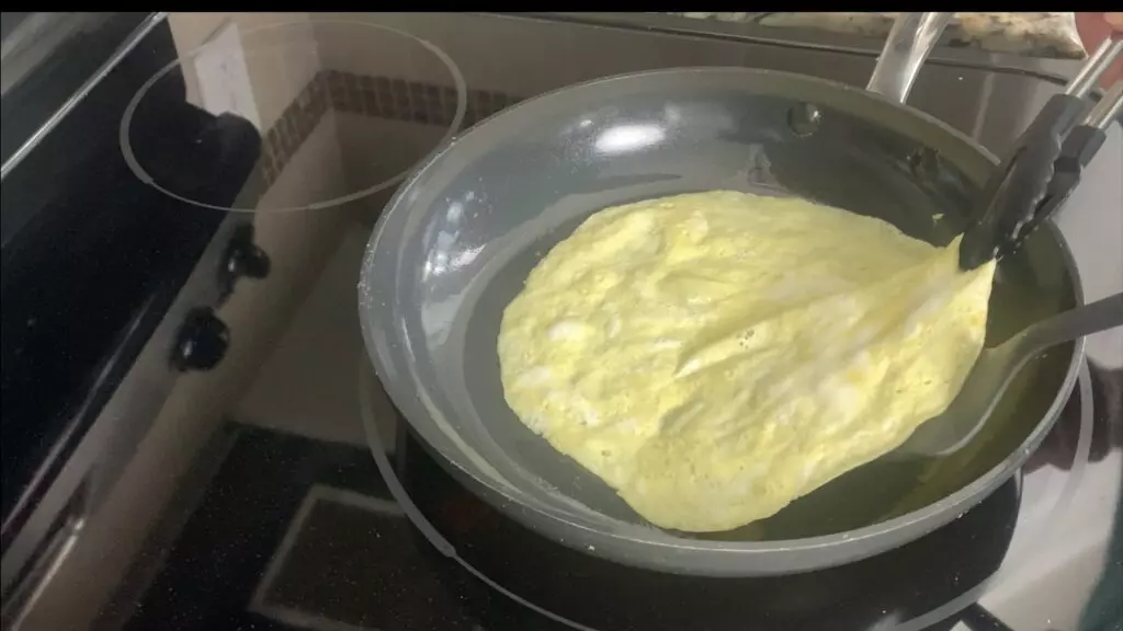 Flip egg in pan