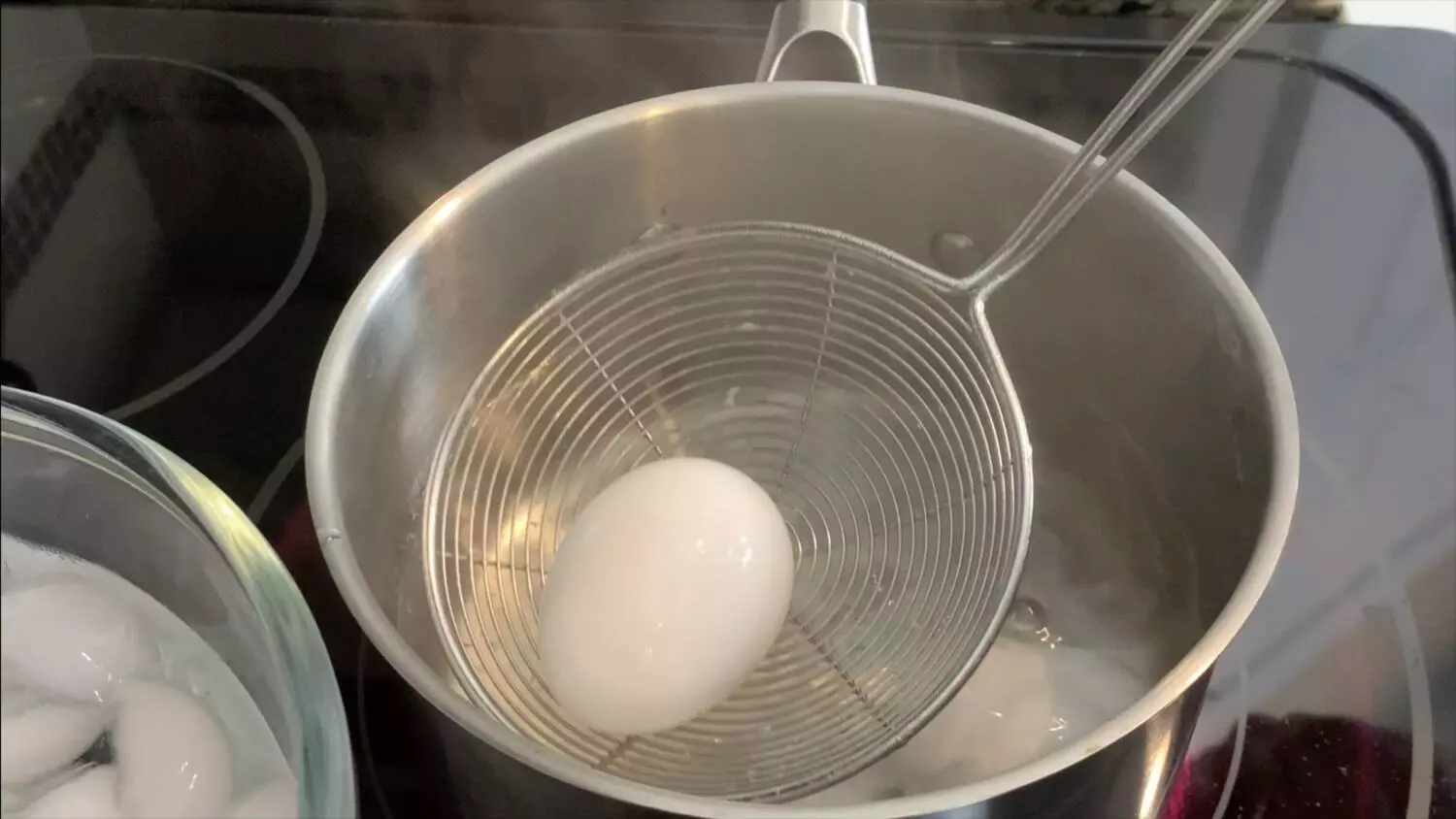 Remove egg from boiling water and add to ice.