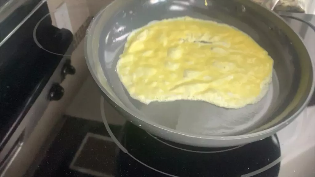 Swirl egg around pan