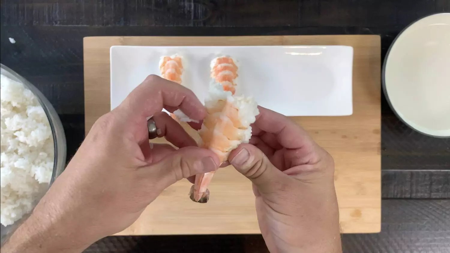 Form shrimp around ball of rice