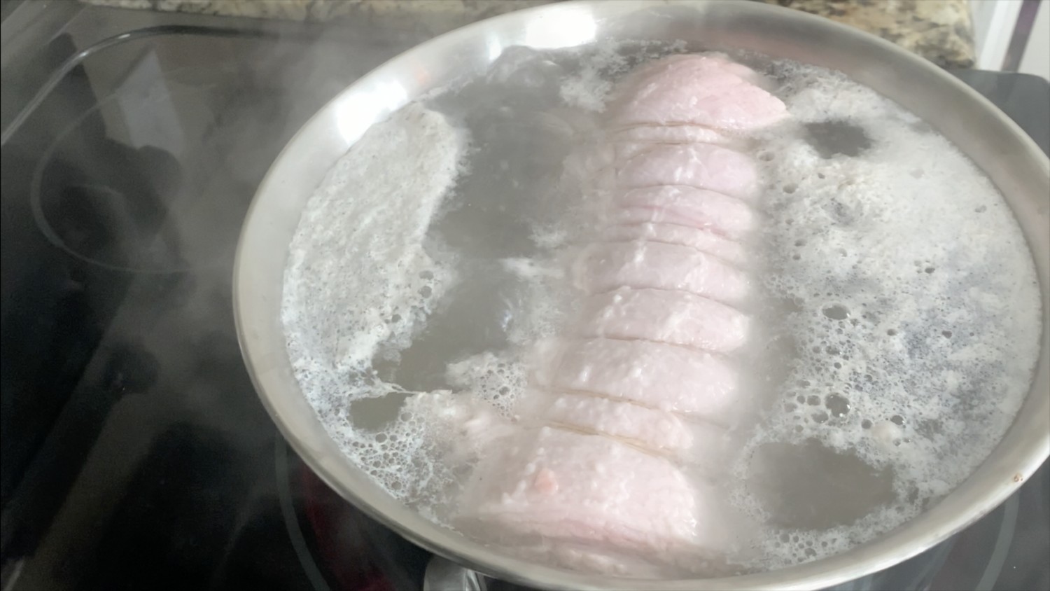 Bring water surrounding pork belly to a boil to remove impurities.