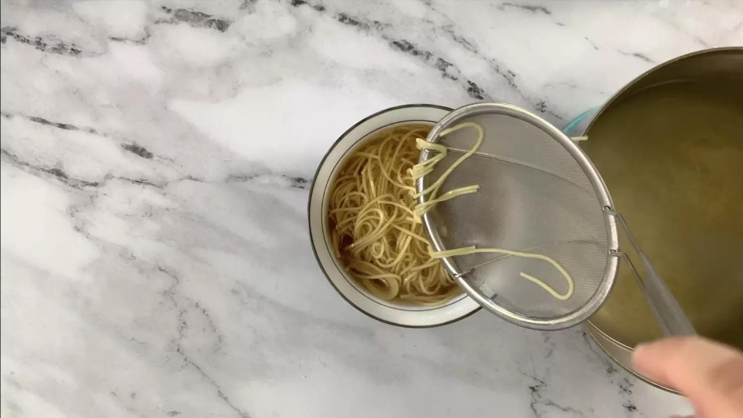 Add noodles to shoyu ramen broth, tare and oils