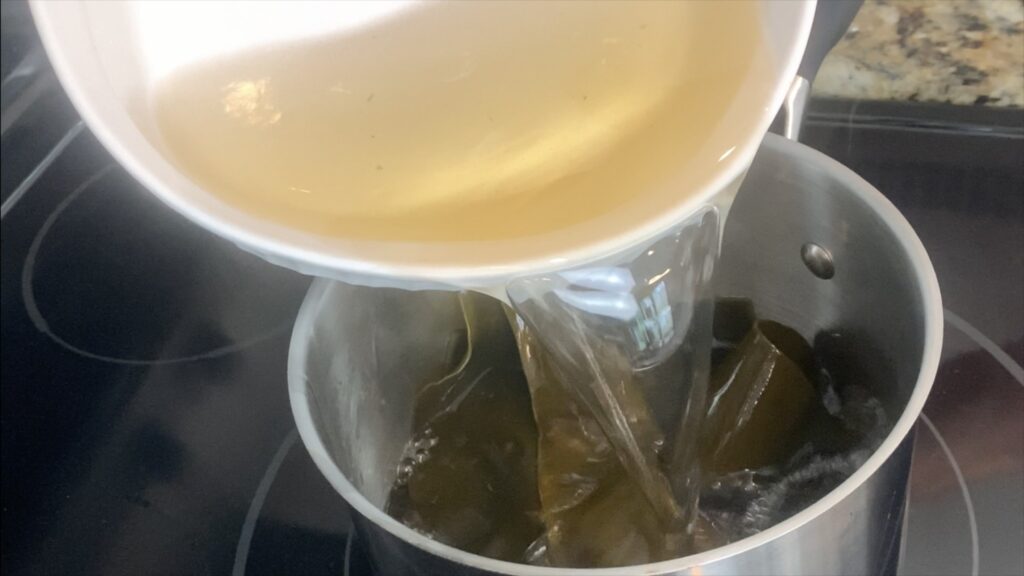 Add water and kombu mix to pot