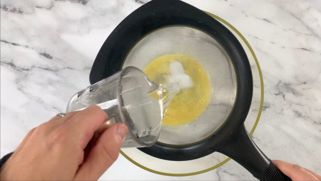 Add ice water to egg to make tempura batter.
