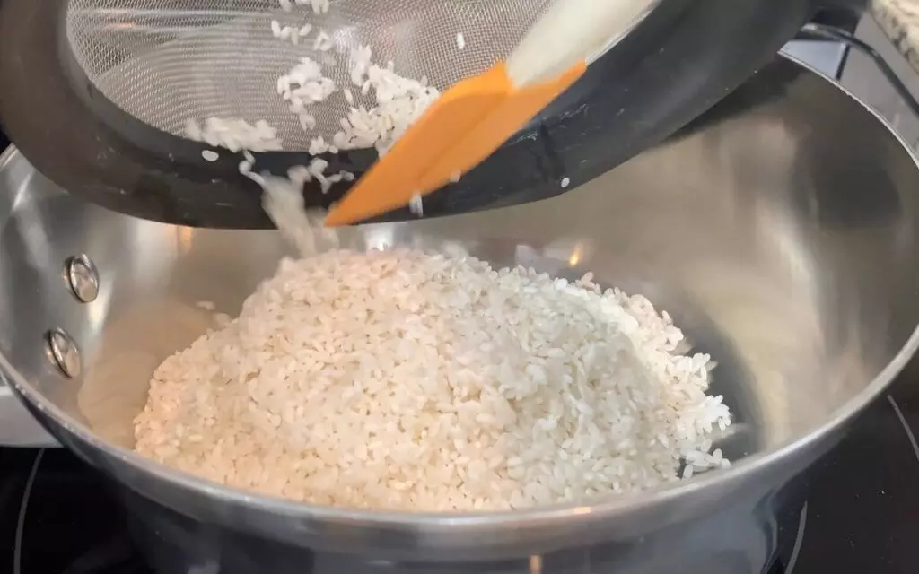 Place rinsed sushi rice in a pot and add water per the vendor instructions