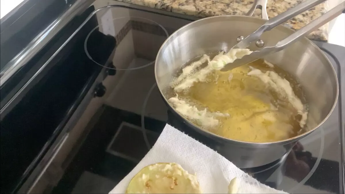 Remove asparagus tempura from oil.