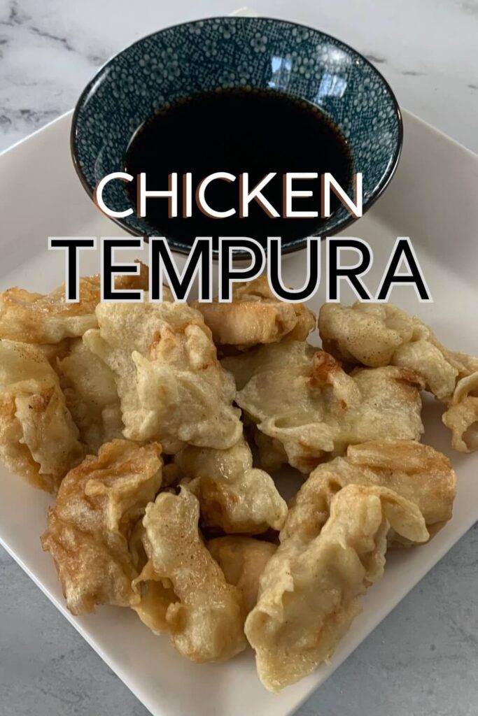 Finished Chicken Tempura on a white plate with tentsuyu.