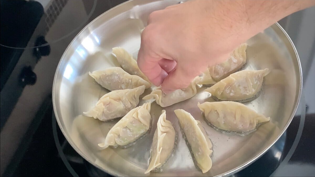 Add gyozas to the hot pan in a single layer.