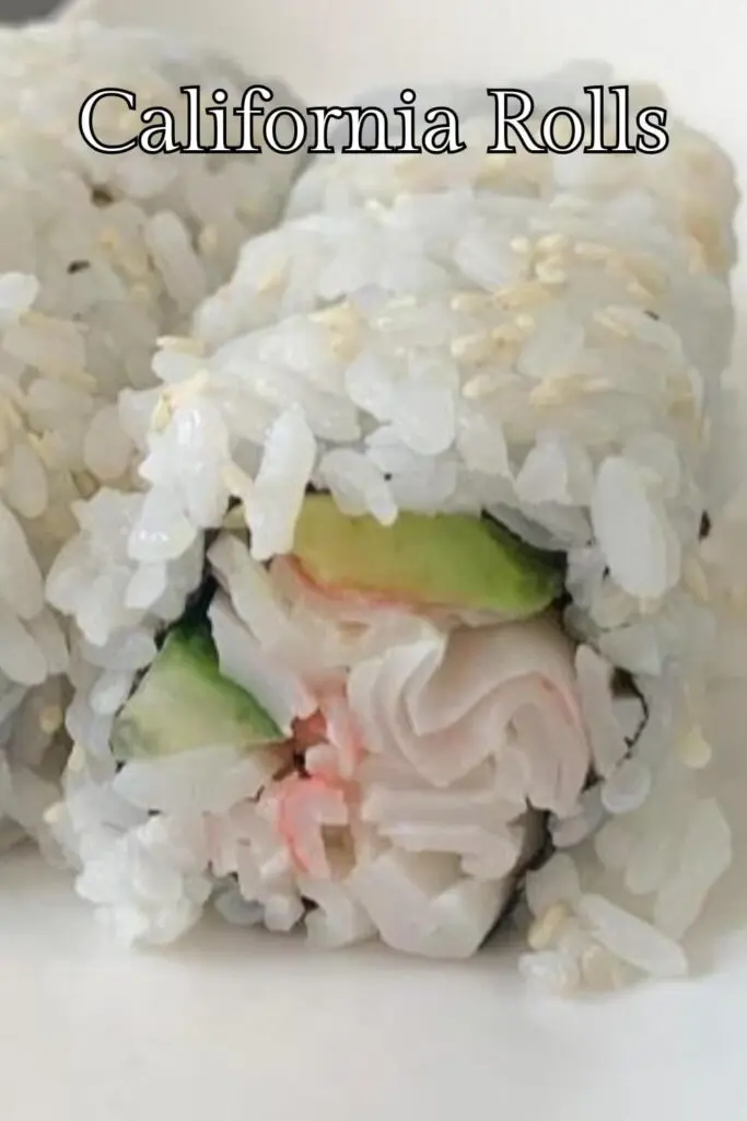 Close up of California roll sushi on a white plate.