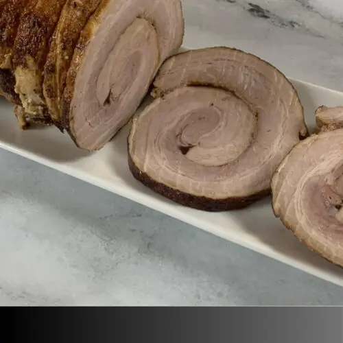 Sliced chasu pork on a white plate