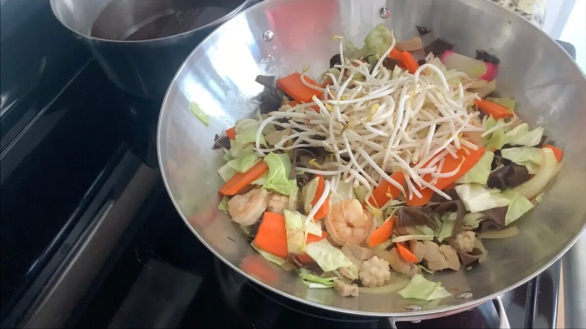 Add bean sprouts and cook for an additional minute.