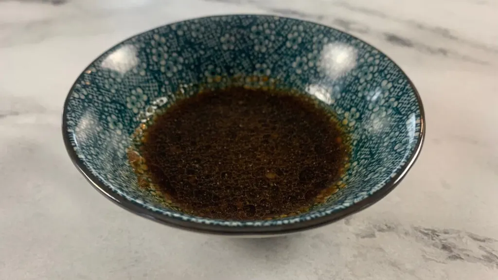 Close up on gyoza sauce in a Japanese ramekin. 