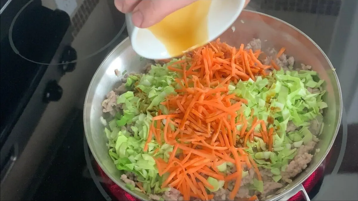 Add soy sauce and dumpling veggies ot the skillet.