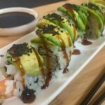 Dragon roll sushi square pic drizzled with unagi sauce.