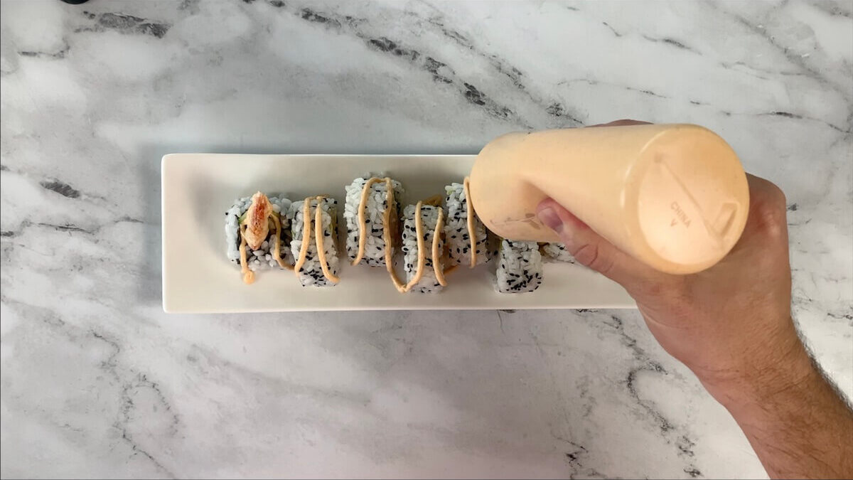Drizzle the dynamite roll with dynamite sauce to give the roll a spicy kick. 