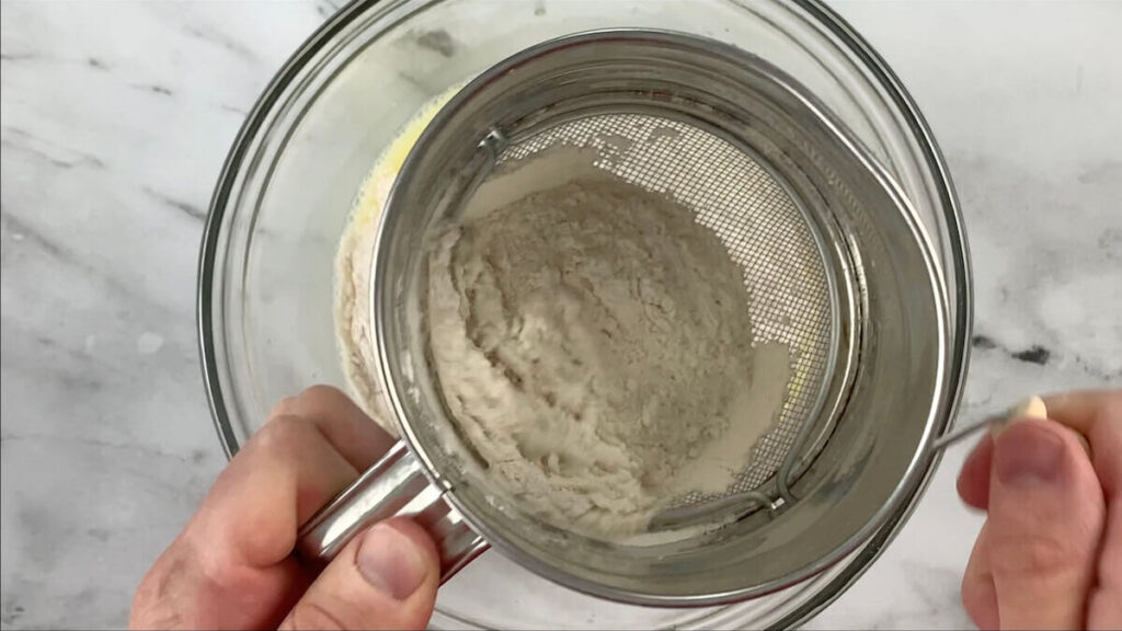 Sift flour into the mixing bowl.