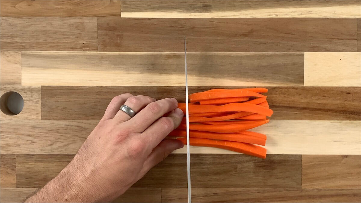 Cut carrots into thin slices.