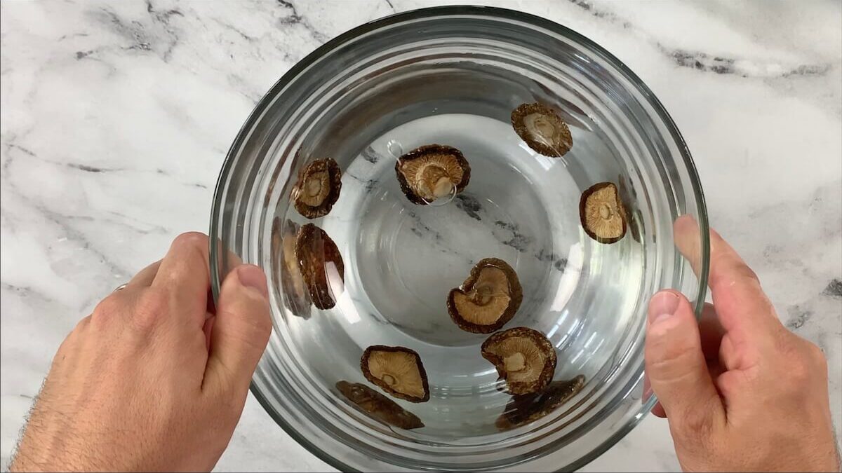 Rehydrate shiitake mushrooms in cold water for at least 20 minutes (overnight in the fridge is better).