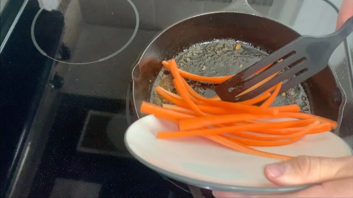 Add carrots to the same skillet that you used to cook the chicken teriyaki strips.