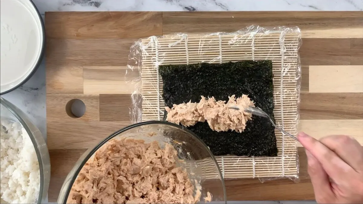 Add the filling to the spicy tuna roll