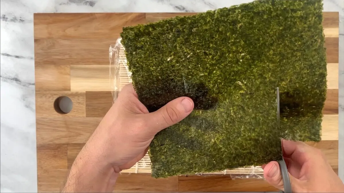 Remove the top portion of the nori sheet.  This helps keep the sweet potato rolls easier to eat with chopsticks.