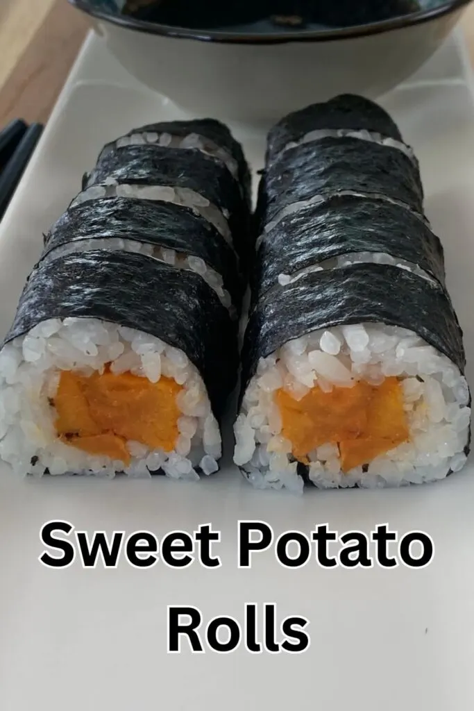 Sweet potato roll vertical pic on a white sushi platter with a ramekin of soy in the background.