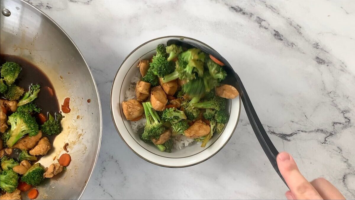 Add 1/4 of the chicken and vegetable teriyaki mix to the rice bowl.