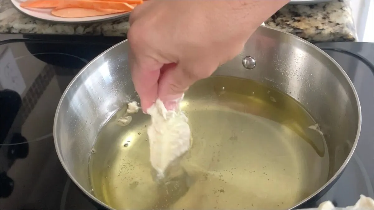 Dip the eggplant in tempura batter and cook in for around a minute and a half.